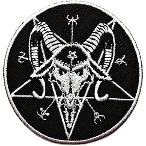 May include: A round, black patch featuring a white embroidered image of a Baphomet symbol. The design includes a pentagram, goat head, and various occult symbols. The patch has a white border.