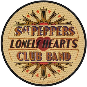 May include: Round patch with the words "Sgt. Peppers Lonely Hearts Club Band" in a retro design. The patch has a tan background with red, gold, and blue accents, a heart, and a black border. Includes copyright text.