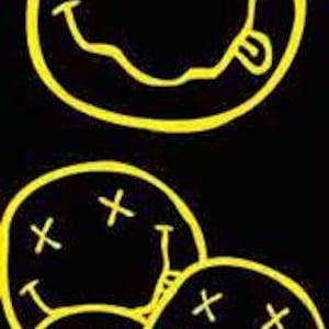 May include: Black vertical graphic with the word "NIRVANA" in yellow at the top. Below, a large yellow smiley face with crossed-out eyes and a tongue sticking out. Multiple smaller smiley faces fill the lower portion of the image.