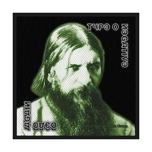 May include: Square patch featuring a green image of a man with a long beard and hair, set against a black dotted background. The words "TYPE O NEGATIVE" and "DEAD AGAIN" are printed in white. The patch has a black border.
