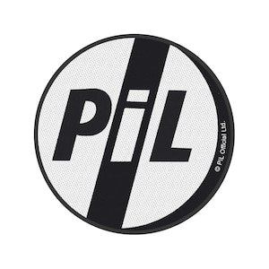 May include: A round, black and white patch featuring the letters "PiL" in a bold, sans-serif font. The letters are black, with a white background and a diagonal black stripe. The text "© PiL Official Ltd." is printed along the right edge.