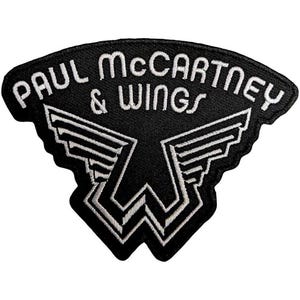 May include: Black embroidered patch with the text "PAUL McCARTNEY & WINGS" in white, curved across the top. Below is a white design of wings and a "W" shape.