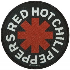 May include: Red Hot Chili Peppers logo patch with a red starburst on a black background. The text "Red Hot Chili Peppers" is in white around the starburst. The text "© 2006 RHCP" is at the bottom of the patch.