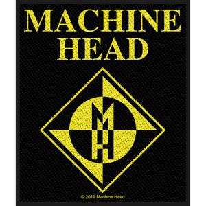 May include: Black square patch with the words "MACHINE HEAD" in yellow, above a yellow and black geometric design. The design includes the letters "M" and "H". The text "© 2019 Machine Head" is at the bottom.