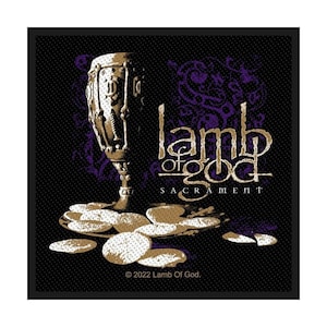 May include: A patch featuring a chalice, bread, and the text "Lamb of God SACRAMENT" in gold and white on a black background. The design includes purple accents and the copyright notice "© 2022 Lamb Of God."