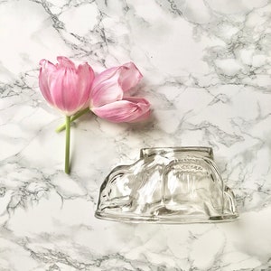 Old jelly mold in molded glass representing a rabbit