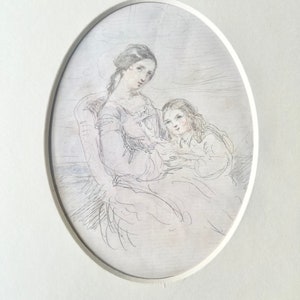 May include: A framed oval pencil sketch depicting two figures, possibly a mother and child. The figures are seated, with the woman on the left and the child on the right. The artwork is in grayscale, with fine lines and shading.