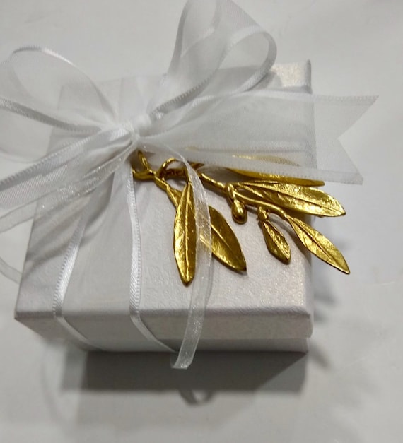 50 wedding favors handmade cast bronze olive twigs placed on a box with satin ribbons. Sugared almonds inside