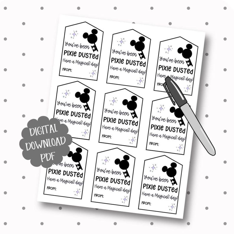 May include: A sheet of nine rectangular gift tags with pointed tops, featuring black text that reads You've been PIXIE DUSTED Have a Magical day! FROM: and a black silhouette of a mouse-ear key icon with small purple star accents, plus a black pen.