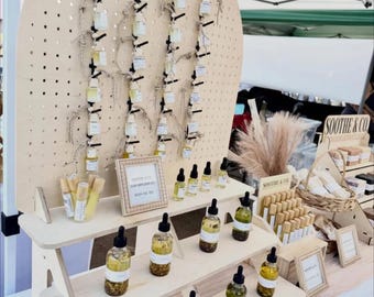 Collapsible three-tiered shelf with pegboard backer
