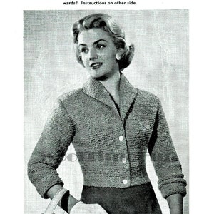 May include: A vintage black and white image featuring a woman in a short jacket with a collar and buttons. The text "SHORTIE JACKET" is displayed at the top. The jacket is textured.