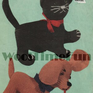 May include: A vintage knitting pattern for a black cat and a brown dog. The pattern is titled "Double Knitting" and includes the yarn requirements: 3 ounces for the dog and 4 ounces for the cat.