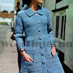 May include: A blue knitted cardigan with a button-up front and pockets. The cardigan has a textured pattern and a collar.