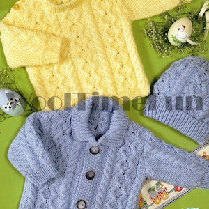 May include: Two knitted baby sweaters, one yellow and one blue, with a matching blue knitted hat. Both sweaters feature a cable knit pattern.