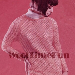 May include: A pink crocheted sweater with a loose fit and a round neckline. The sweater has a lacy pattern and is shown on a model with short dark hair.