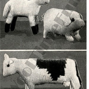May include: Three knitted stuffed toys: a white lamb, a white pig, and a black and white cow. The toys are all made with a textured knit fabric.
