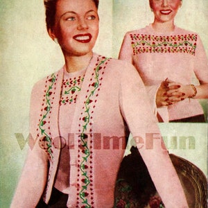 May include: A vintage-style pink knit cardigan and top set with floral embroidery. The cardigan features a button-up front and long sleeves. The floral design includes red flowers and green leaves. The image also shows a woman wearing the outfit.