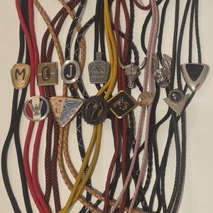 Vintage Lot of 13 Metal Bolo Ties, Nice Different Designs, Initials, M, D J, Crown Royal, Bull, More