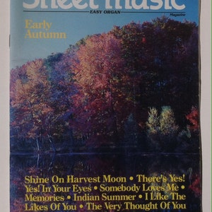 May include: A vintage magazine cover for "Sheet Music: Easy Organ" magazine, featuring a colourful autumn landscape with trees reflected in a lake. The cover text reads "Early Autumn" and lists song titles: "Shine On Harvest Moon", "There's Yes!", "Yes! In Your Eyes", "Somebody Loves Me", "Memories", "Indian Summer", "I Like The Likes Of You", and "The Very Thought Of You".
