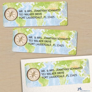 May include: Address labels with a world map design. Each label features a compass rose and the text "MR. & MRS. JONATHAN SCHWARTZ, 553 WALKER DRIVE, FORT LAUDERDALE, FL 33425". The labels have a light blue background with green and tan continents.