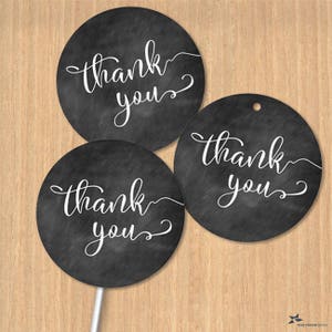 May include: Three round black and white thank you stickers with a chalkboard background. The text is in a white cursive font.
