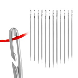 May include: A set of 12 silver needles with a red thread threaded through a silver needle threader.