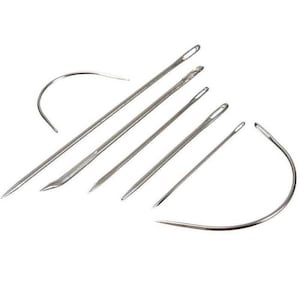 May include: A set of seven silver sewing needles, including a curved needle. The needles are sharp and pointed, and they are ideal for sewing fabric.