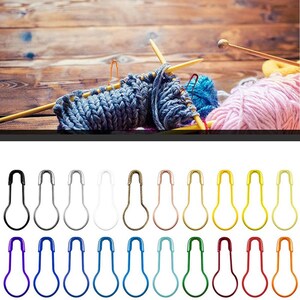 May include: Assortment of 20 safety pins in various colors, including black, silver, white, gold, rose gold, yellow, red, blue, light blue, and turquoise. The pins are arranged in two rows of ten.