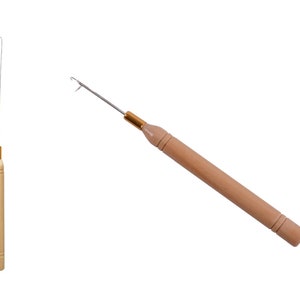 May include: Two wooden yarn needles with metal tips. The needles are used for threading yarn through small spaces.