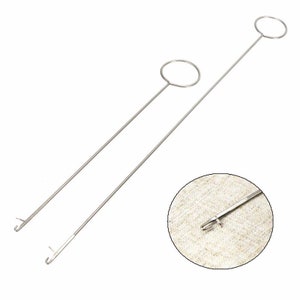 May include: Two silver metal thread loopers with a hook on one end and a circular loop on the other end.
