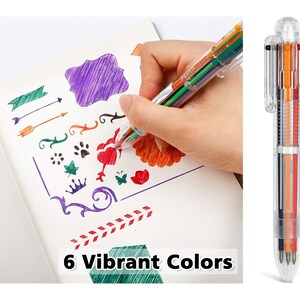 May include: A clear multi-coloured pen with six different coloured ink cartridges. The pen is being used to draw on a white notebook with a variety of designs. The text "6 Vibrant Colors" is printed on the notebook.