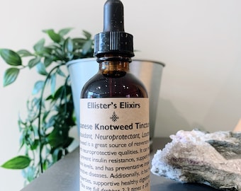 May include: A brown glass bottle with a dropper top and a label that reads "Ellister's Elixirs Japanese Knotweed Tincture". The label also includes information about the product's benefits, such as being a neuroprotectant and a source of resveratrol.