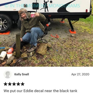 May include: A five-star review for a decal featuring a cartoon character named Eddie. The review mentions placing the decal near the black tank on an RV and how it brings joy to fellow campers. The reviewer also mentions receiving smiles from passersby on the highway.