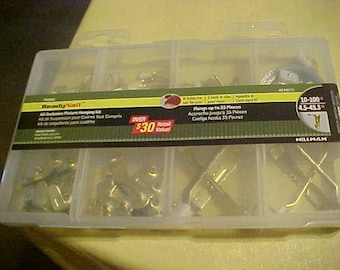 Brand new unopened Ready Nail picture hanging assortment brass finish with free shipping