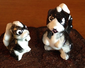 Kelvin&#39;s Bone China Japan- Figurine of Two Skunks on Original Wooden Base