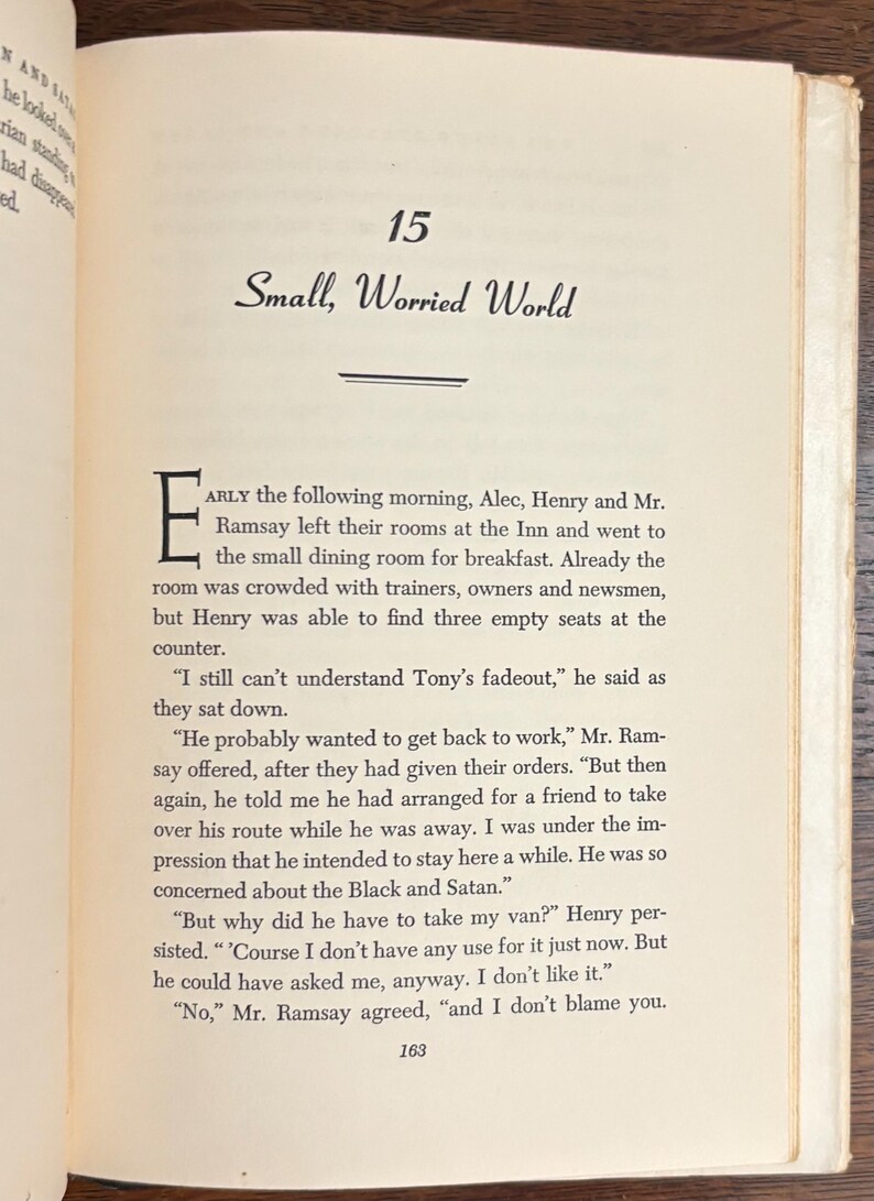 May include: Open book page with text. The title "Small, Worried World" is at the top, with the number "15" above it. The text is in black font on a cream-colored page. The page is slightly yellowed.