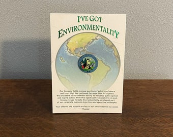2001 Disney Cast Exclusive Jiminy Cricket “I’ve Got Environmentality” Lapel Pin on a Cardboard Stand