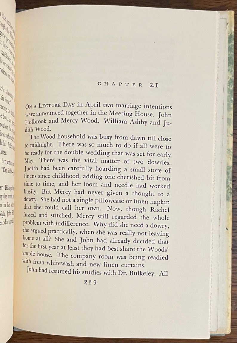 May include: A page from a vintage book with the chapter title "Chapter 21" and text about a wedding. The text describes the preparations for a double wedding and mentions the bride's dowries.