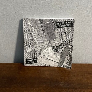 Edición de 1999 de The Betrayed Confidence de Edward Gorey- The Betrayed Confidence: Siete series de postales Dogear Wryde