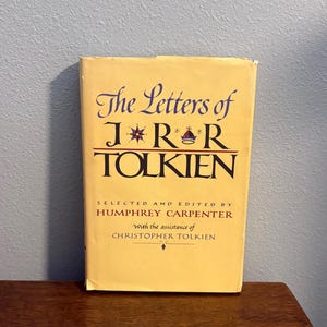 May include: A rustic wooden sign with the text "Welcome to our home" in white lettering. The sign features a distressed finish and a simple, inviting design, perfect for entryway decor.