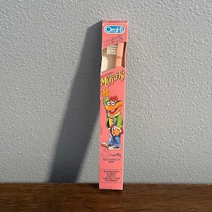 Cepillo de dientes Oral-B Muppets Scooter para niños de 1984 - Cepillo de dientes vintage Muppets Scooter, en su caja original