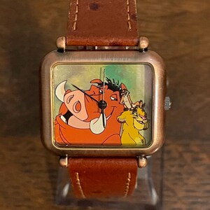 Montre Le Roi Lion exclusive aux cartes de crédit Disney des années 1990 - montre unisexe vintage Simba, Timon et Pumbaa