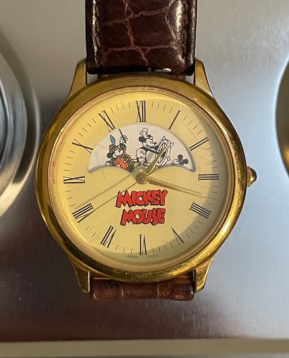 1990's Mickey, Inc. Rotating Mickey Through the Years Watch 1990's Mickey, Inc. Rotating Mickey Through the Years Watch