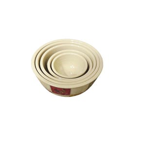 May include: A set of five off-white ceramic mixing bowls nested together. The bowls are graduated in size, with a small decorative band around the base of the largest bowl. The bowls are ideal for food preparation.