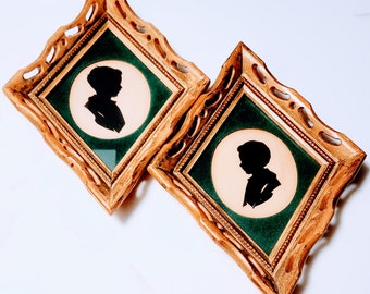 Conjunto de dos retratos antiguos de siluetas huecas en marcos de madera