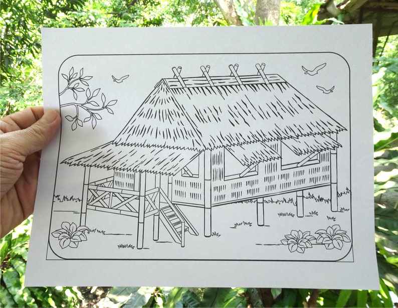 May include: A black and white line drawing of a traditional house with a thatched roof. The house is on stilts and has a porch with a railing. There are two small trees and two birds in the sky.
