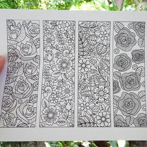 showing printouts of zen doodle flower coloring markers