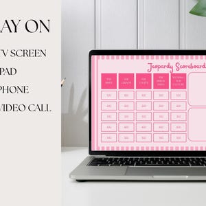 May include: A pink and white Jeopardy Scoreboard template displayed on a laptop computer screen. The scoreboard has two columns for teams, with spaces for points. The text "Jeopardy Scoreboard" is at the top of the screen.