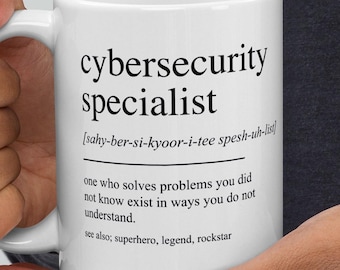 May include: White ceramic mug with the words "cybersecurity specialist" in black, along with a definition. The mug also includes the phonetic pronunciation and a description of the role. A great gift for a cybersecurity professional.