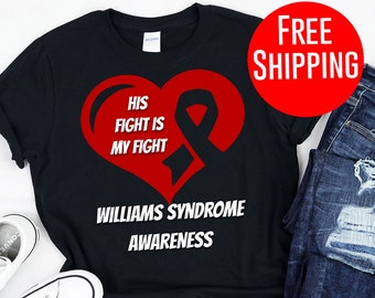 May include: Black t-shirt with a red heart and a white ribbon. The text on the shirt reads "His Fight Is My Fight" and "Williams Syndrome Awareness".